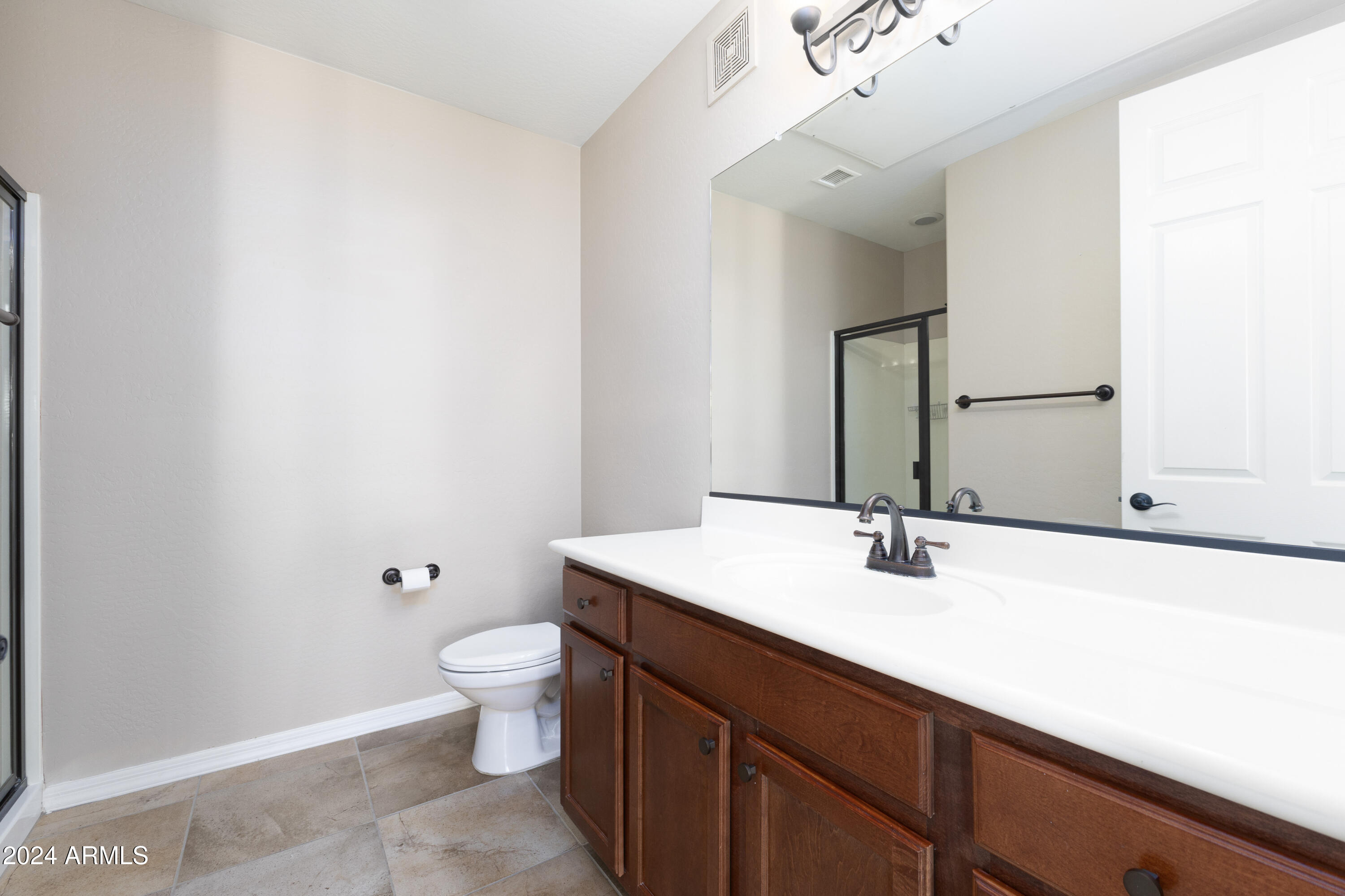 3330 South Gilbert Road, Unit 2010 Chandler, AZ 85286 - Photo 9 of 20 a bathroom with a sink a toilet and mirror