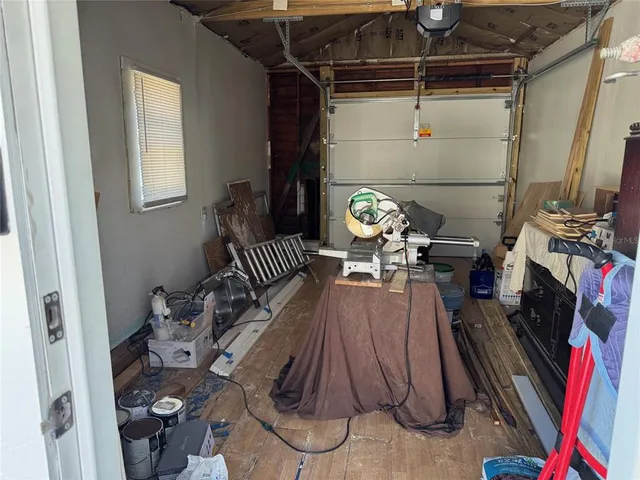 a view of living room and dining room with wooden floor