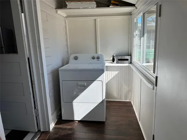 a view of a hallway with washer and dryer