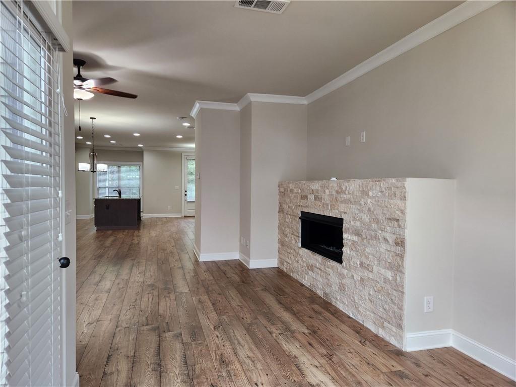 1323 Faircrest Way Suwanee, GA 30024 - Photo 9 of 16 a view of a livingroom with wooden floor