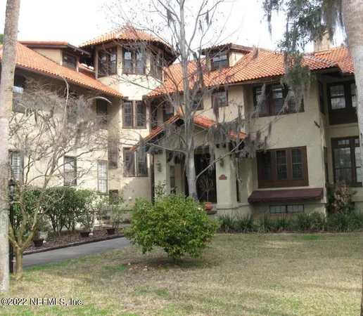 a front view of a building with garden