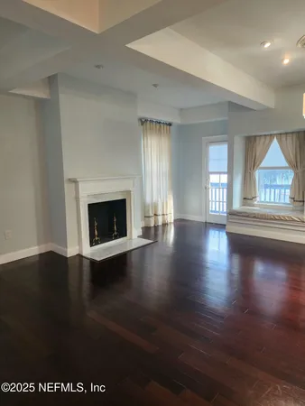 a kitchen with stainless steel appliances granite countertop a stove a sink and white cabinets