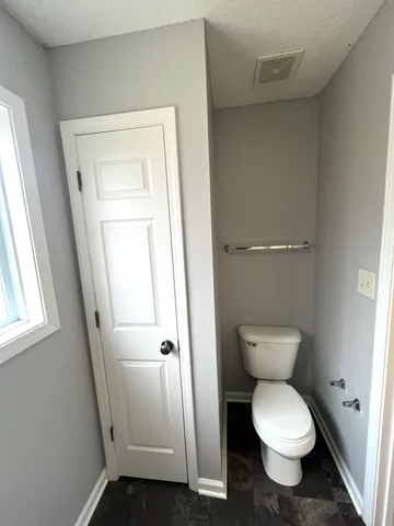 a bathroom with a toilet