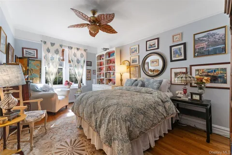 a bed room with a bed and a chandelier