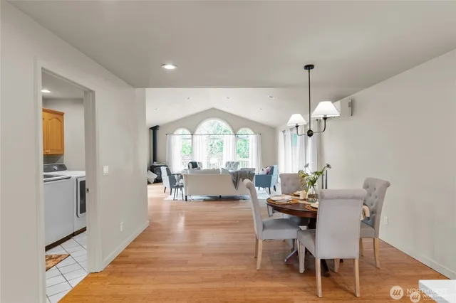 a view of a dining room with furniture window and wooden floor