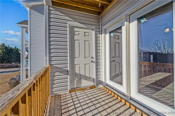 a view of a balcony with furniture