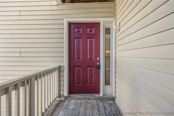 a view of a wooden door of the house