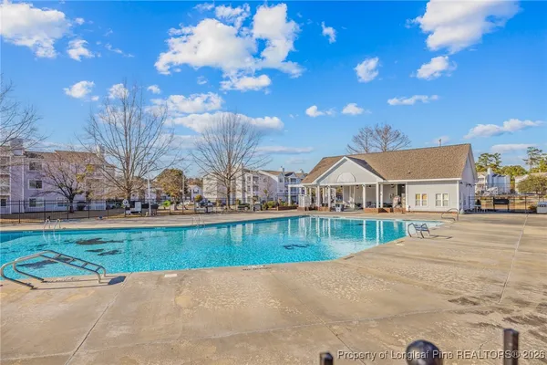 a view of a town with large trees and a big yard