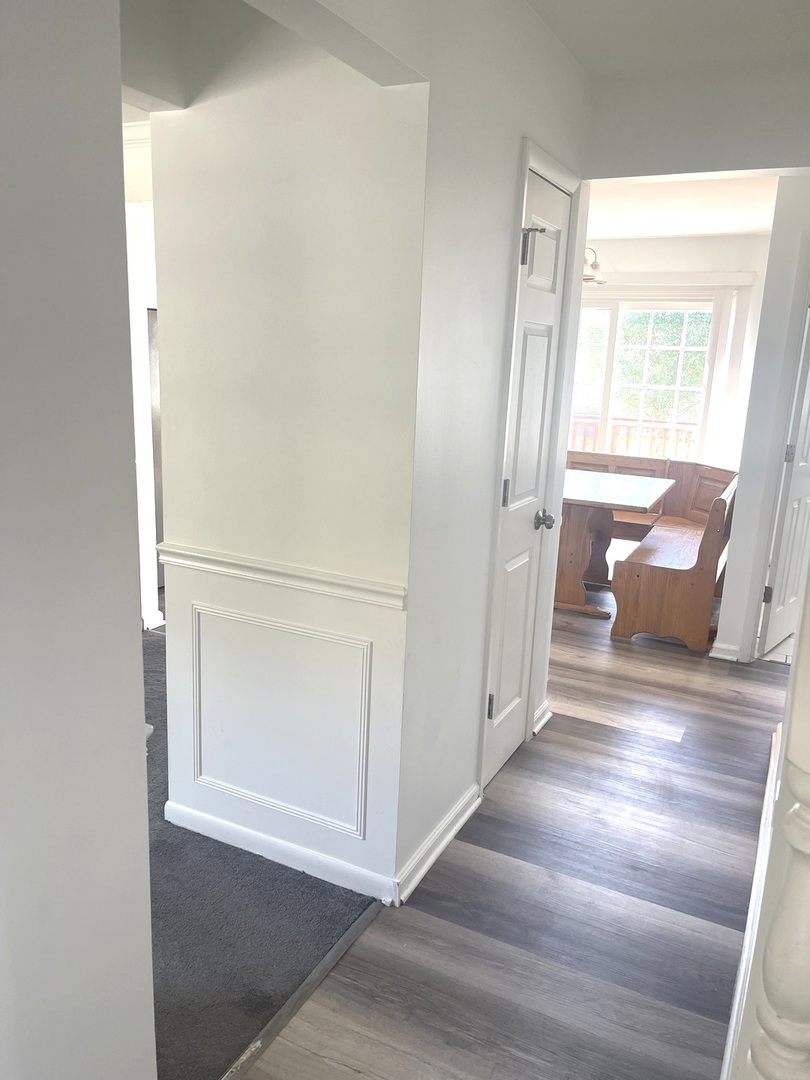 2411 Leckrone Drive Plainfield, IL 60586 - Photo 3 of 11 a view of a hallway with wooden floor and cabinet