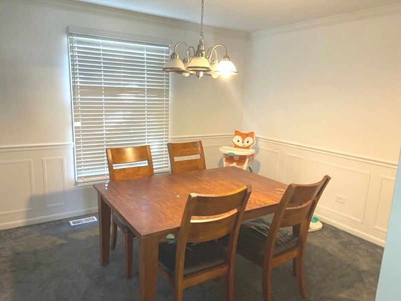 2411 Leckrone Drive Plainfield, IL 60586 - Photo 6 of 11 a view of a dining room with furniture and window