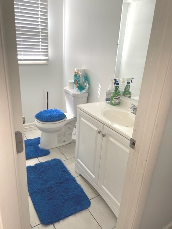 2411 Leckrone Drive Plainfield, IL 60586 - Photo 8 of 11 a bathroom with a sink toilet and mirror