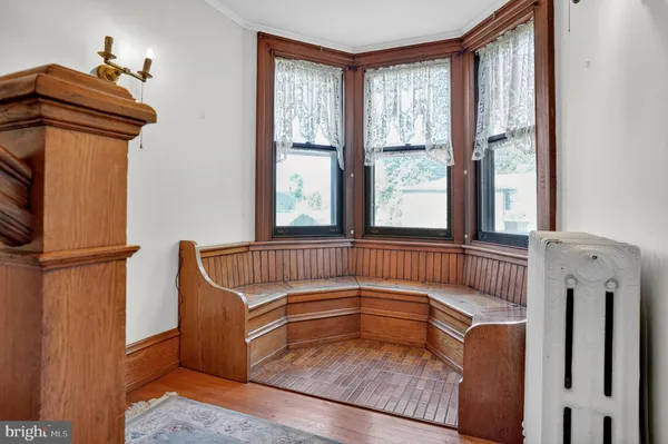 a view of a porch with furniture and a window