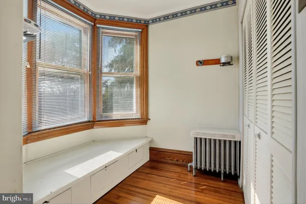 a view of a bathroom with a tub and shower