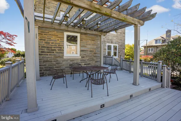 a patio with table and chairs