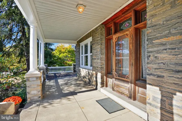 a view of a porch with a bench