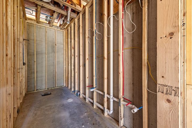 a view of a hallway with wooden door