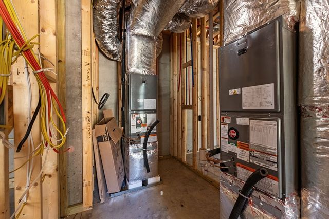 a view of an empty room with a fireplace and a window