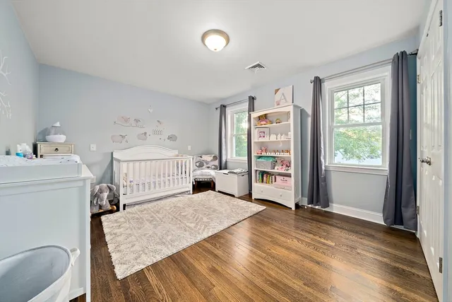 a room with a bed and a window