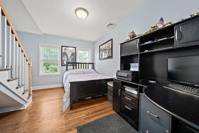 a bedroom with furniture and a window