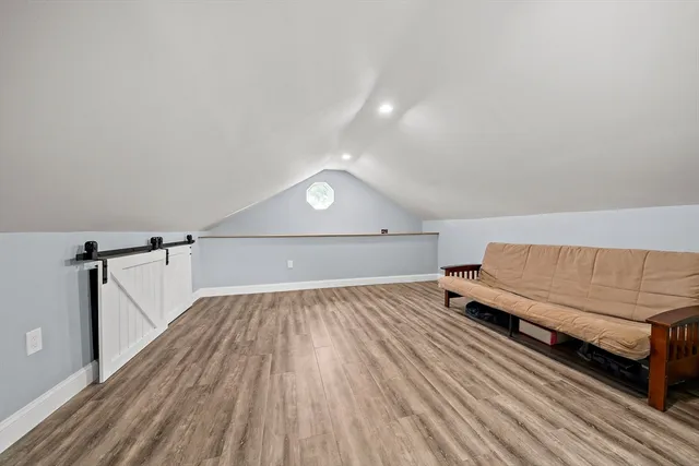a view of a room with wooden floor