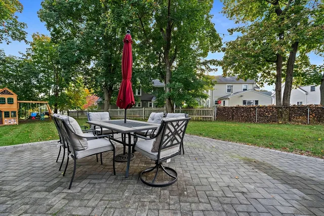 a view of a sitting area with furniture and wooden deck