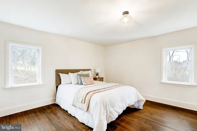 a bed room with a bed and a window