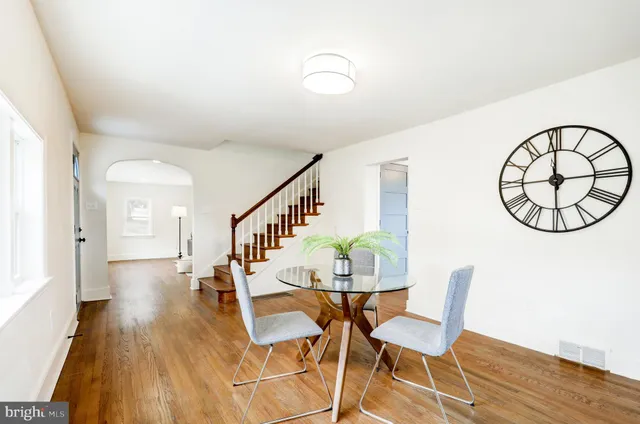 a view of livingroom and dining room with wooden floor