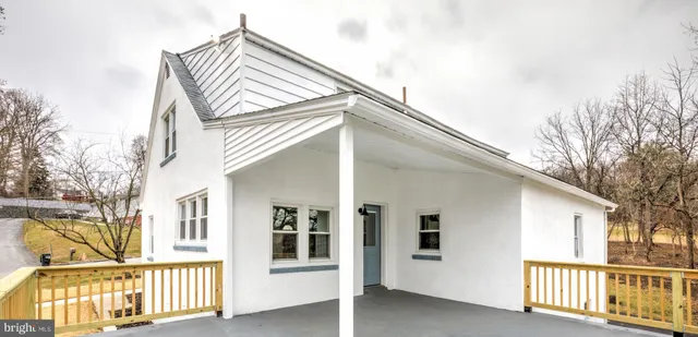 a view of a chairs and tables in the balcony