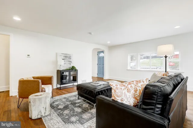 a bedroom with furniture and a lamp