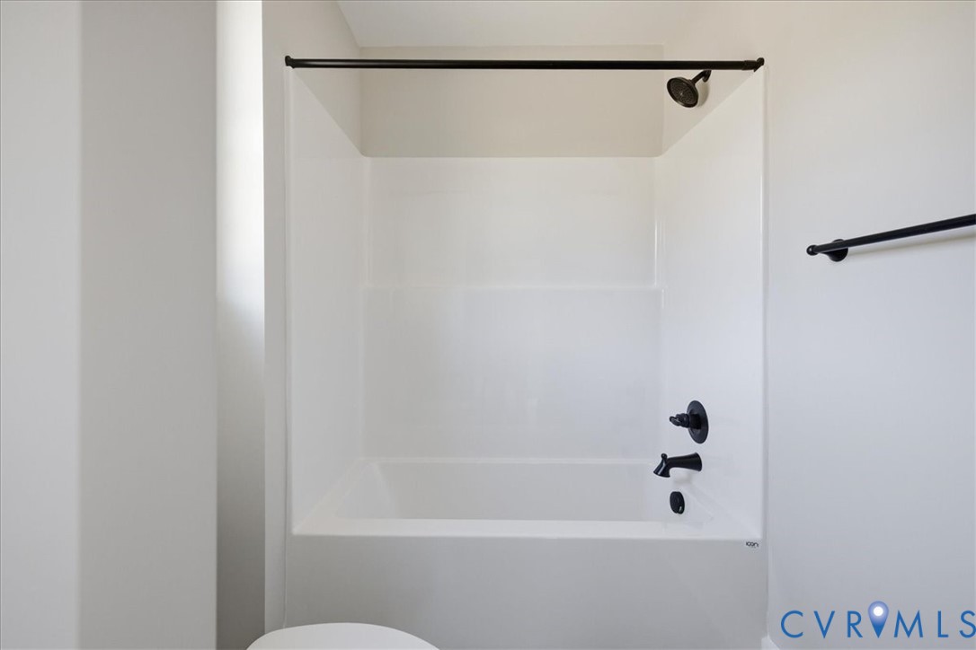 15203 Cox Road Church Road, VA 23833 - Photo 25 of 32 White bathtub with integrated shower, matte black