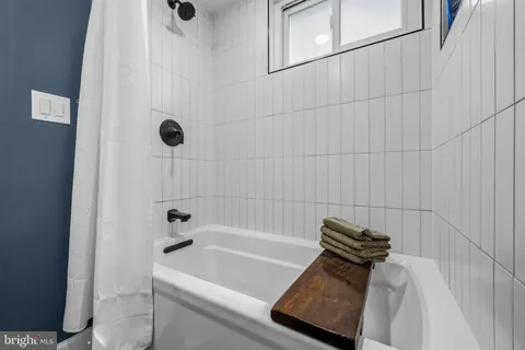 a bathroom with a bath tub