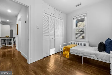 a bedroom with furniture and a window