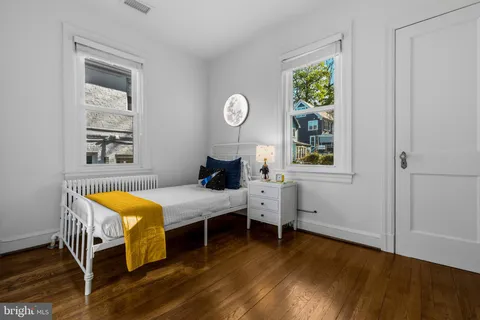 a bedroom with bed and a window