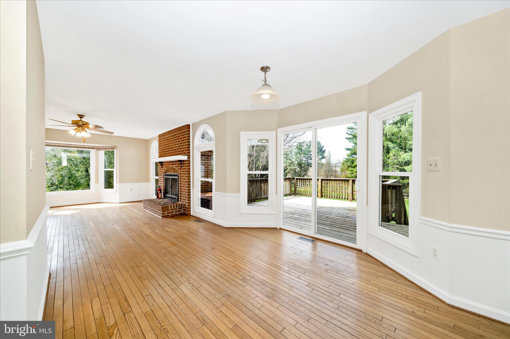 17004 Spates Hill Road Poolesville, MD 20837 - Photo 18 of 67 a view of an empty room with wooden floor and a window