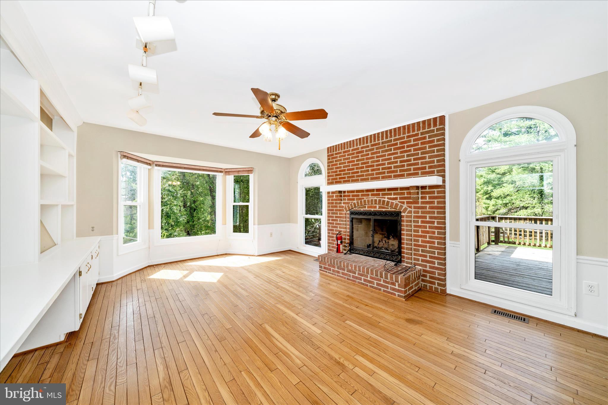 17004 Spates Hill Road Poolesville, MD 20837 - Photo 21 of 67 a view of an empty room with wooden floor fireplace and a window