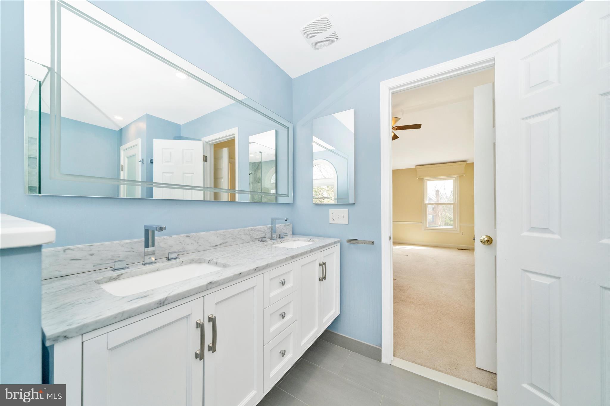 17004 Spates Hill Road Poolesville, MD 20837 - Photo 29 of 67 a bathroom with a granite countertop sink and a mirror