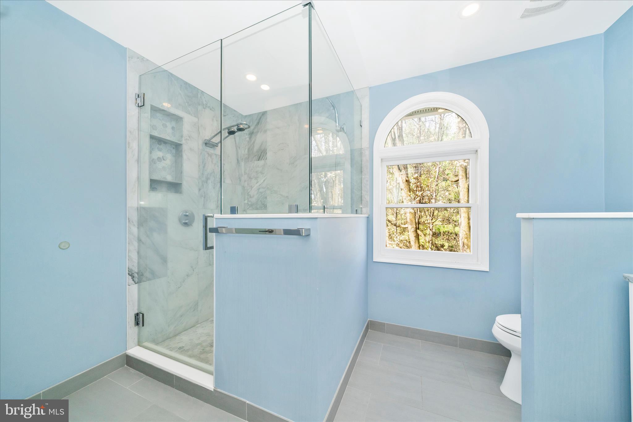 17004 Spates Hill Road Poolesville, MD 20837 - Photo 30 of 67 a bathroom with a bathtub and a shower