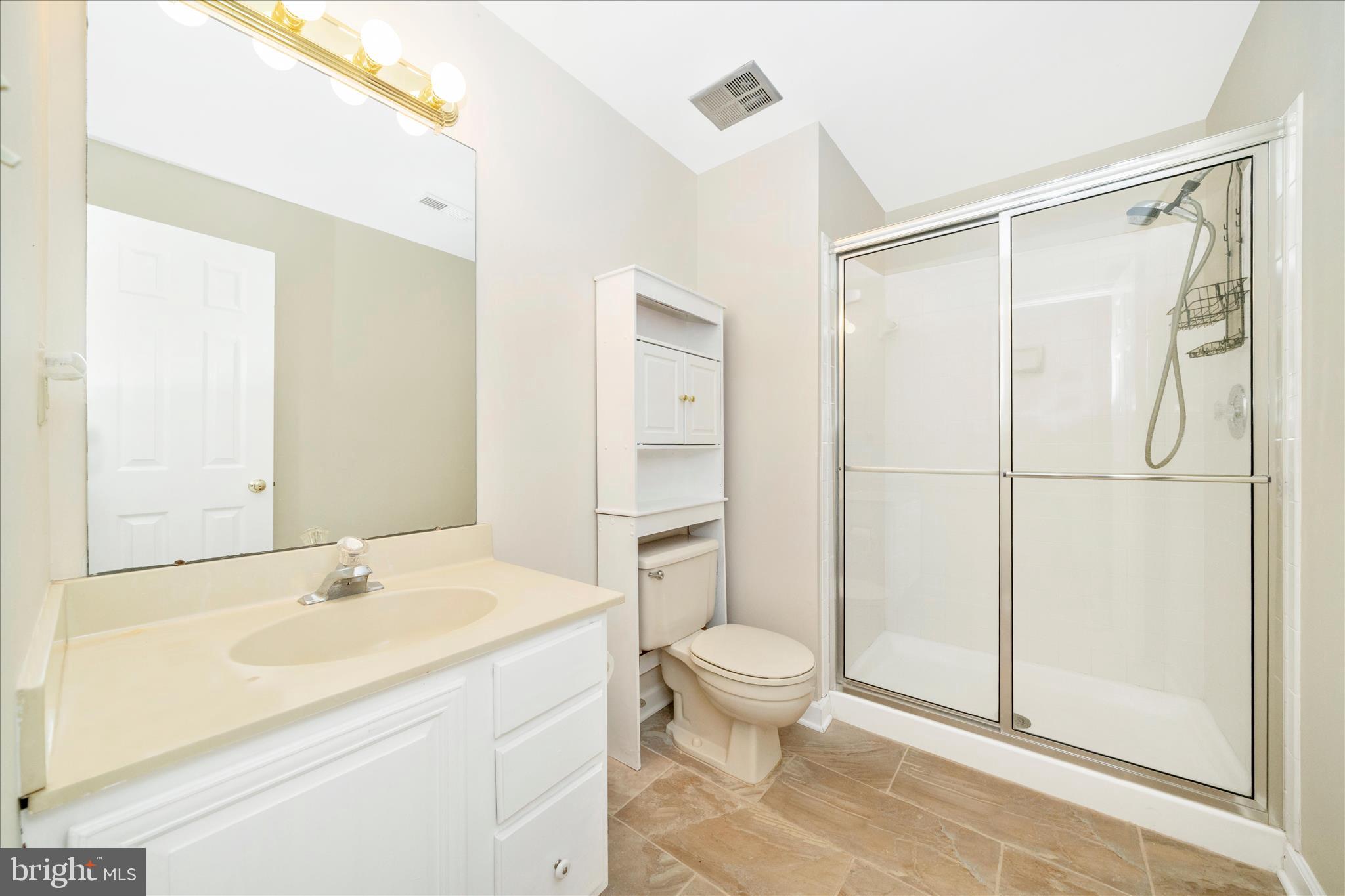 17004 Spates Hill Road Poolesville, MD 20837 - Photo 45 of 67 a bathroom with a granite countertop sink toilet and shower