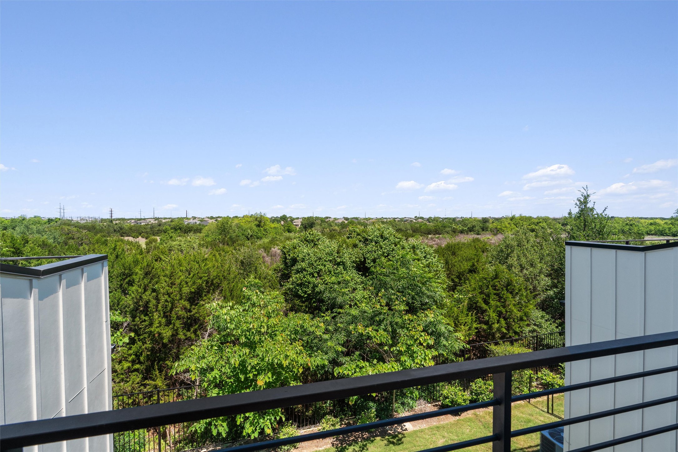 590 Old Mill Road, Unit 153 Cedar Park, TX 78613 - Photo 14 of 40 a view of a green yard from a balcony