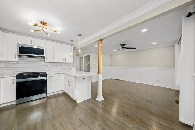 a kitchen with a stove and a microwave