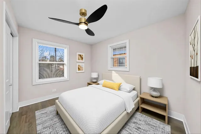 a bedroom with a large bed and a window