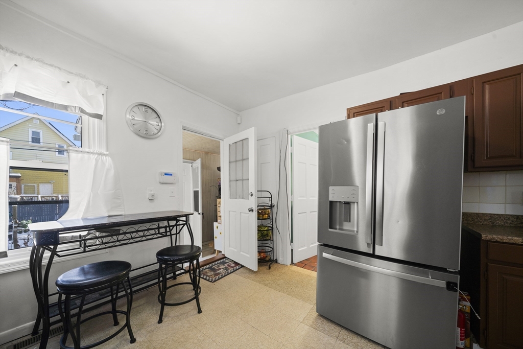 55 Malden Street Springfield, MA 01108 - Photo 14 of 40 a kitchen with stainless steel appliances a refrigerator and a stove top oven