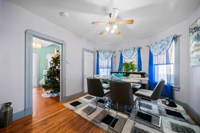 a view of a dining room with furniture window and wooden floor