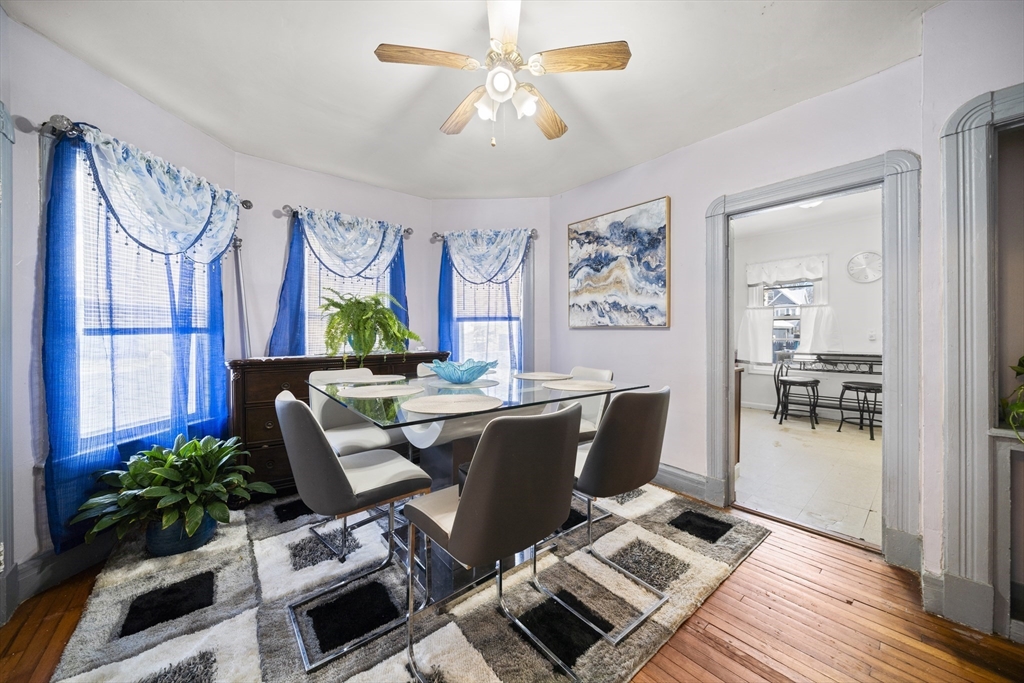 55 Malden Street Springfield, MA 01108 - Photo 17 of 40 a living room with furniture a chandelier and a window