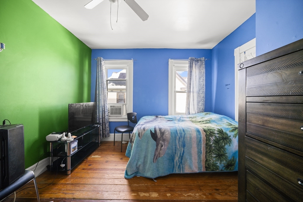 55 Malden Street Springfield, MA 01108 - Photo 20 of 40 a bedroom with a bed and a flat screen tv