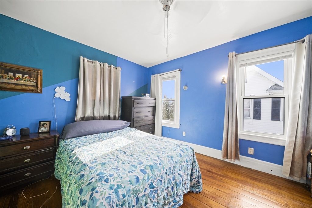 55 Malden Street Springfield, MA 01108 - Photo 24 of 40 a bedroom with a bed and a dresser