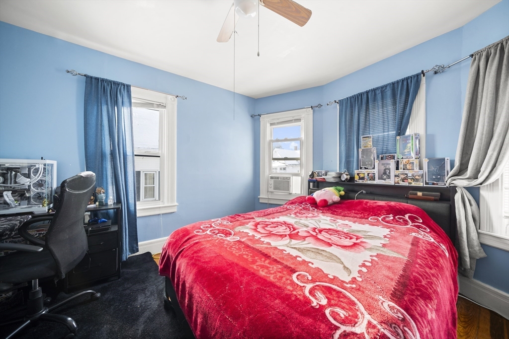 55 Malden Street Springfield, MA 01108 - Photo 26 of 40 a bedroom with a bed and dresser with window