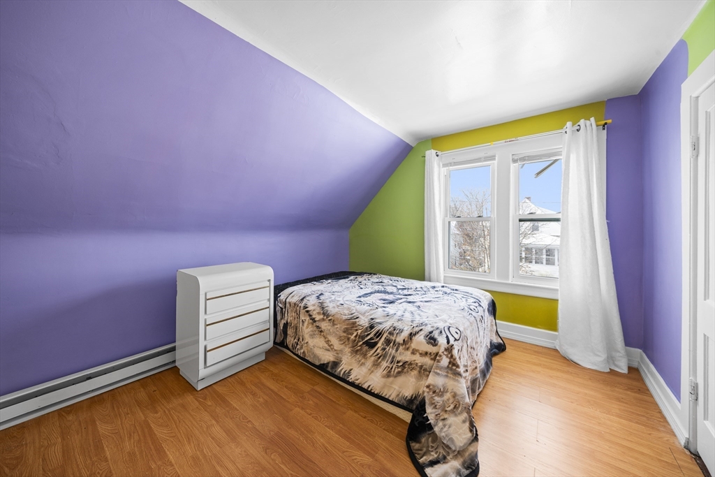 55 Malden Street Springfield, MA 01108 - Photo 29 of 40 a bedroom with a bed and a window