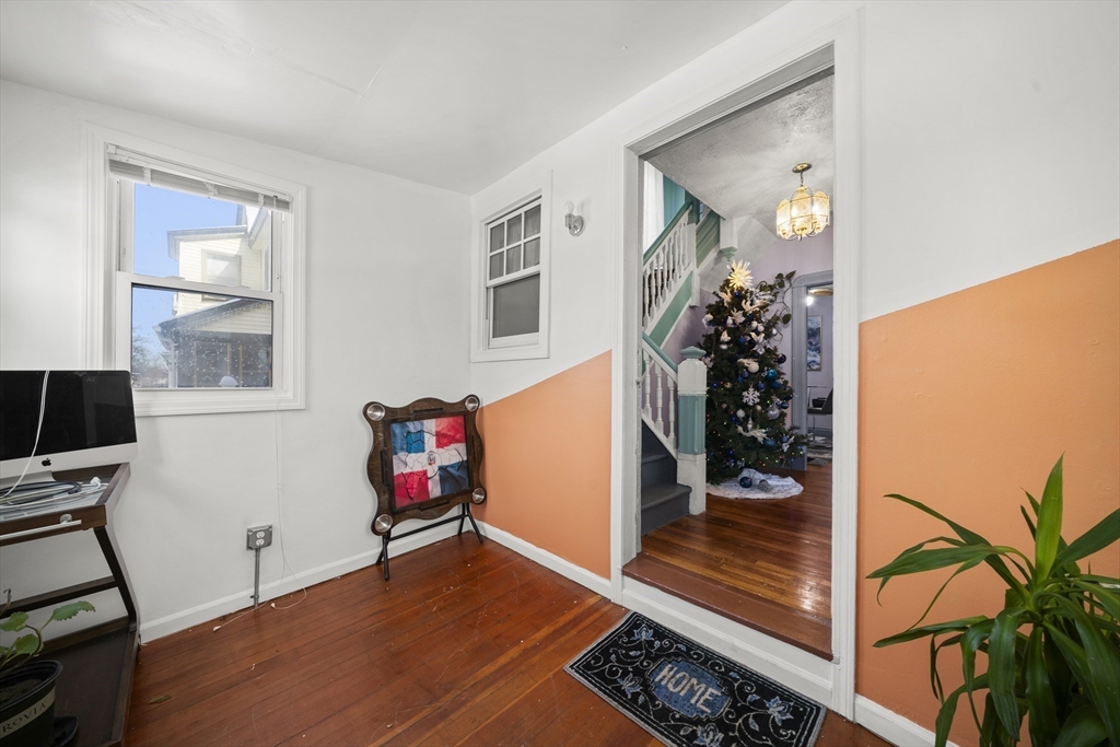 55 Malden Street Springfield, MA 01108 - Photo 3 of 40 a view of a livingroom with wooden floor and entryway