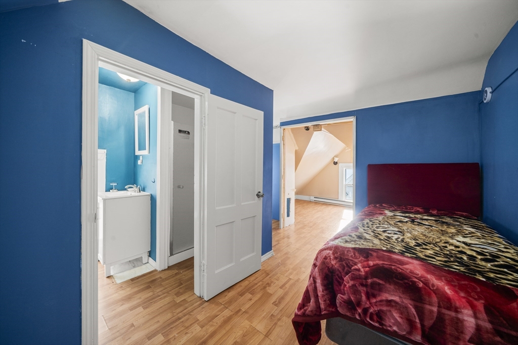 55 Malden Street Springfield, MA 01108 - Photo 33 of 40 a bedroom with a bed and a window